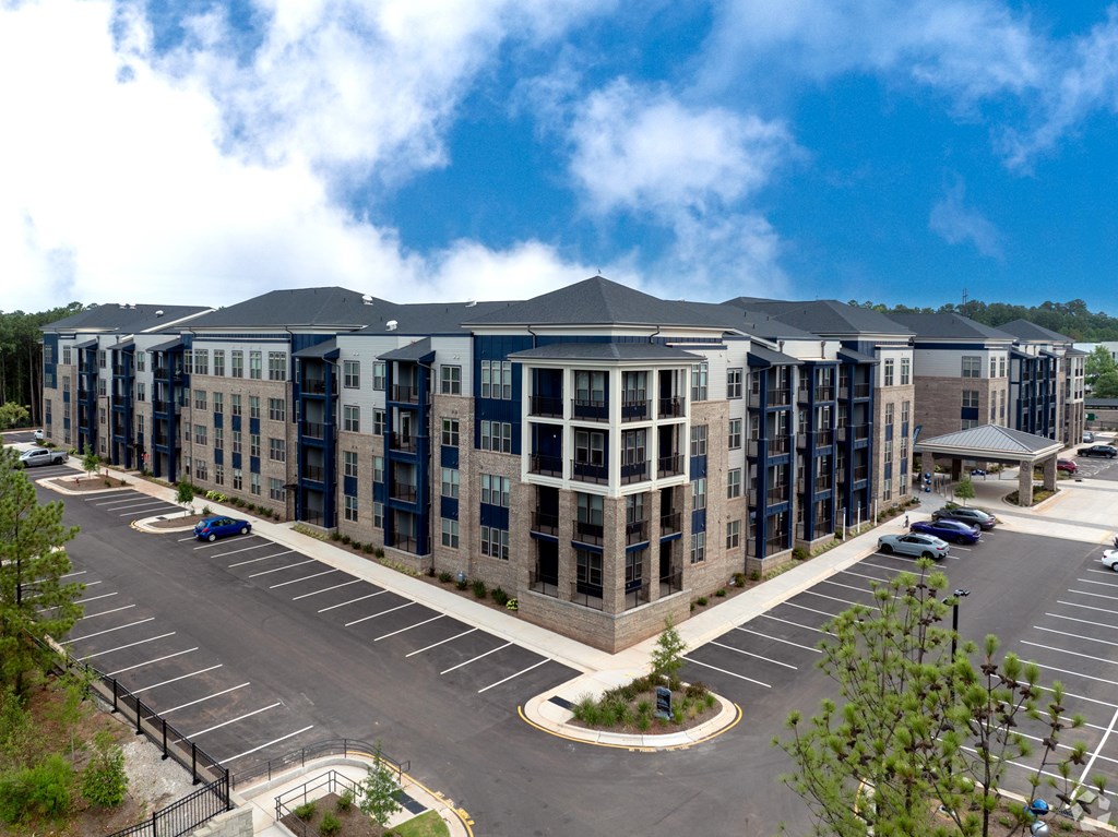 an aerial view of an apartment building in a parking lot at Preston Ridge, Cary, 27513